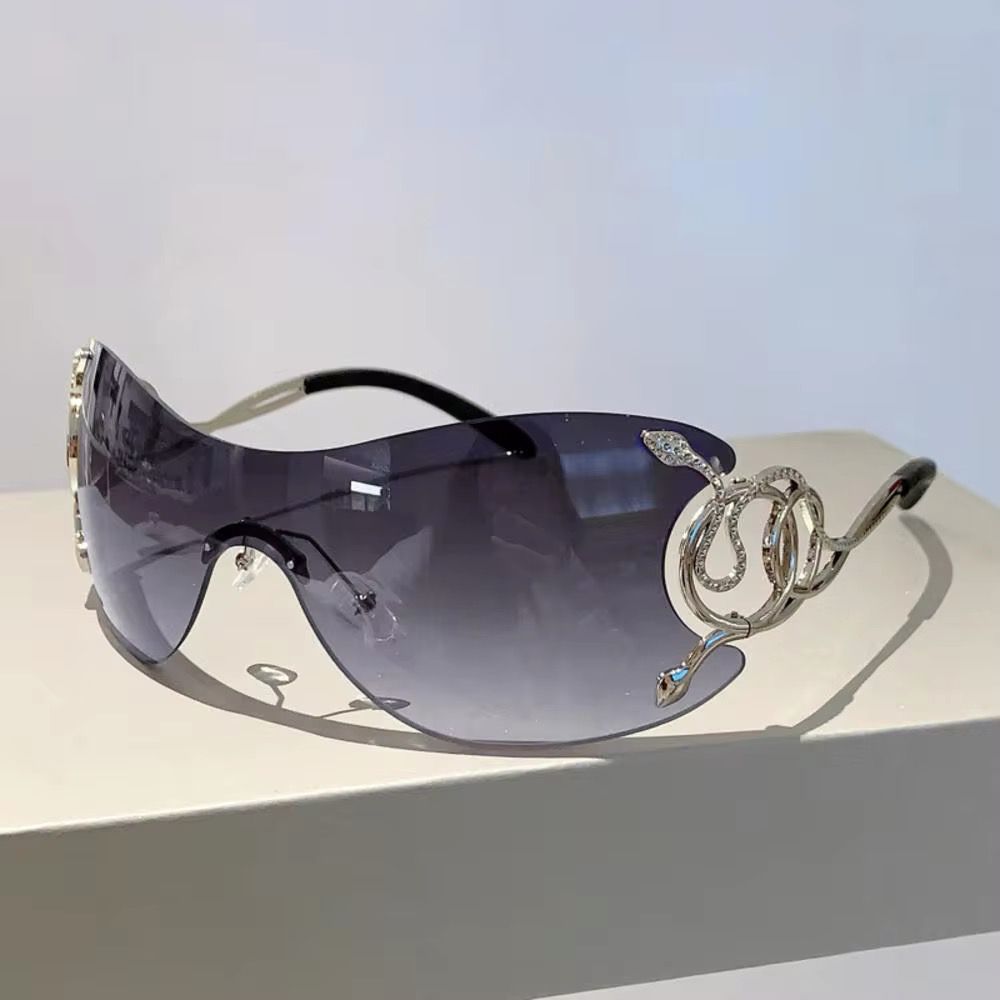 ROBERTA - Oversize Sonnenbrille mit Schlangendetails